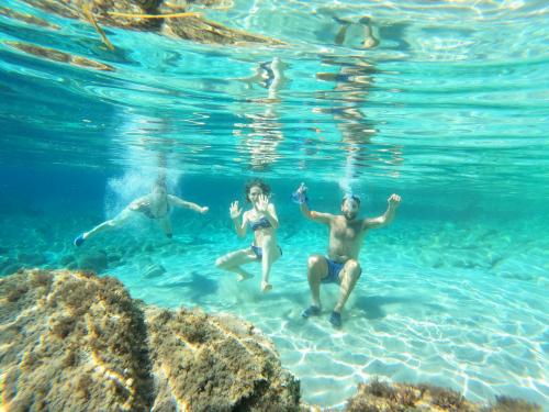 Hikers in the crystalline sea of Sant'Antioco