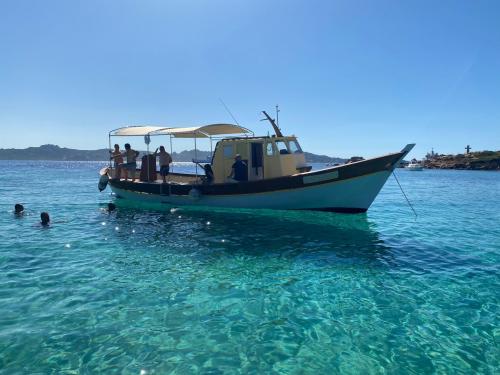 Stop for a swim during a wooden gozzo excursion to Maddalena