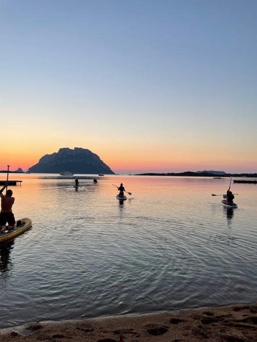 Group of hikers at dawn on SUP