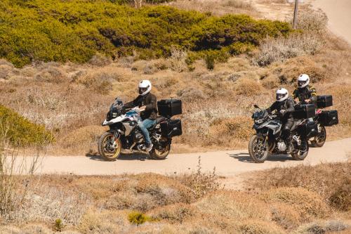 Group of hikers on BMW motorcycles during tour in Sardinia