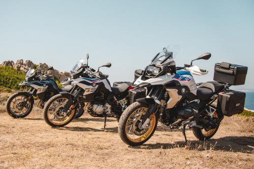 BMW motorcycles lined up in Sardinia on the north coast