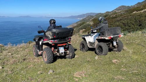 Day-trippers on quads in the coast of Bosa