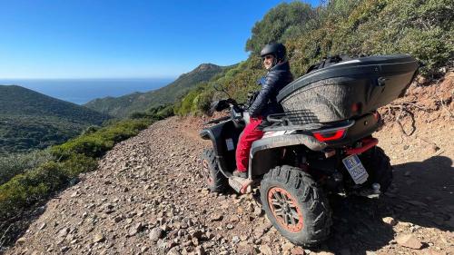 Day-tripper on a quad on a rocky trail