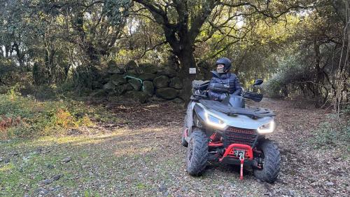 Woman on a quad in the nature near Bosa