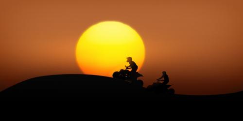 Quad hikers at sunset