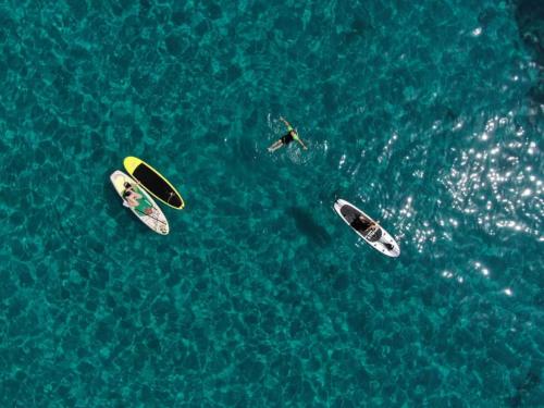 <p>SUP between the crystal clear waters of the Gulf of Orosei</p><p><br></p>