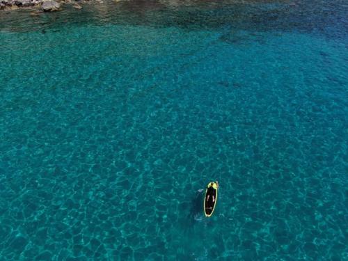 <p>SUP between the crystal clear waters of the Gulf of Orosei</p><p><br></p>