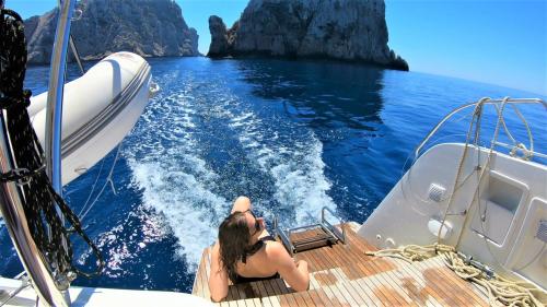 <p>Girl aboard a catamaran in the Gulf of Alghero</p><p><br></p>