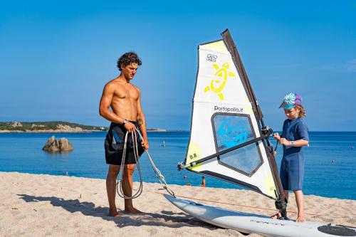 Instructor with child during windsurfing experience