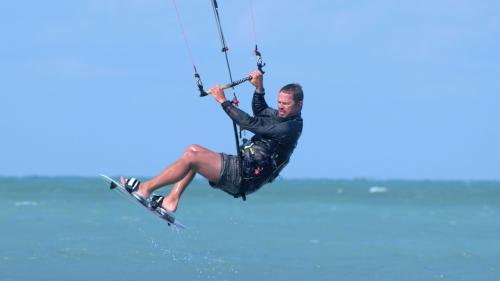 Hiker windsurfing in north east Sardinia