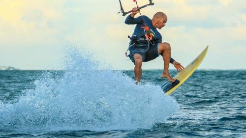 Boy wakeboarding in Aglientu