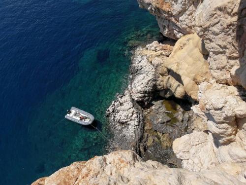 Rubber boat in the coves near Tavolara