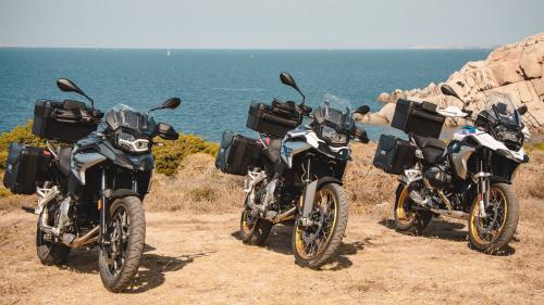 Close-up three BMW motorcycles at a pier in Sardinia