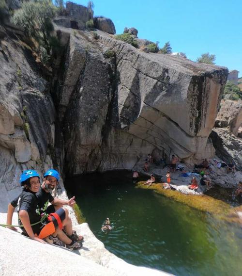 Couple ready to dive into the water during a guided canyoning experience