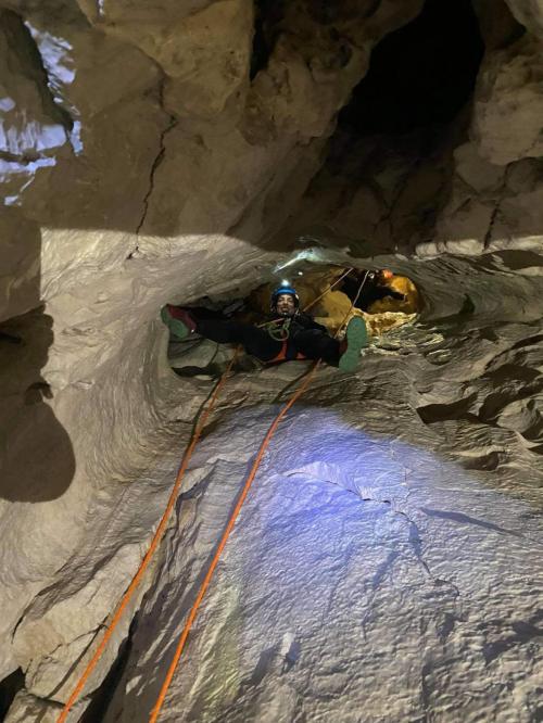 Abseiling with rope inside the Donini Grotto
