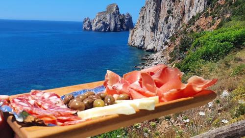 Aperitif of local Sardinian products with a view of Pan di Zucchero