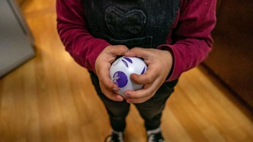 Child with his craft candle in Mamoiada