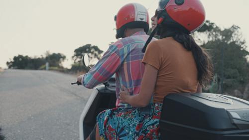 Couple in electric scooter to discover Sardinia