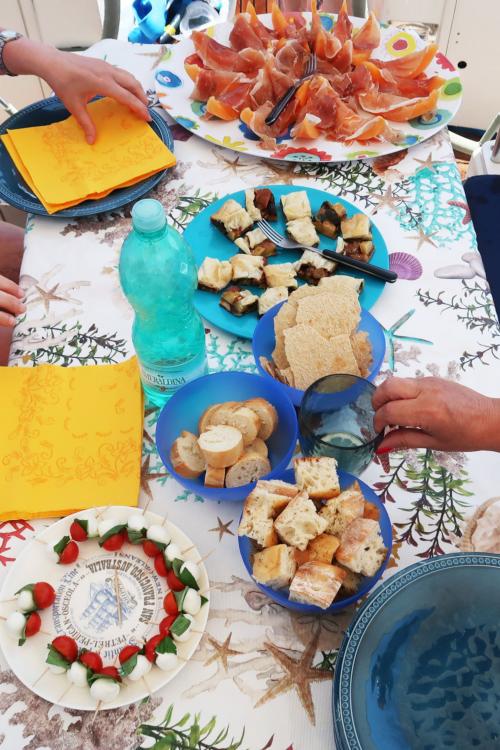 Aperitif on board a sailboat in north-eastern Sardinia