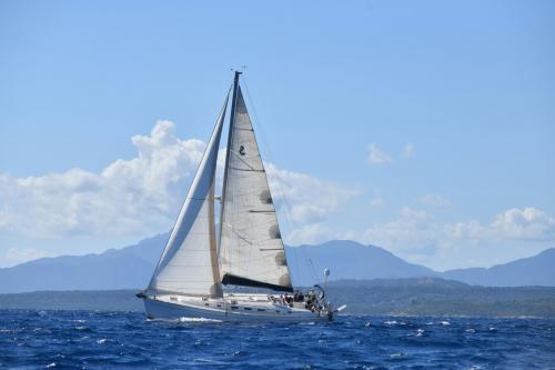 Sailing boat sails in the Gulf of Orosei during daily excursion