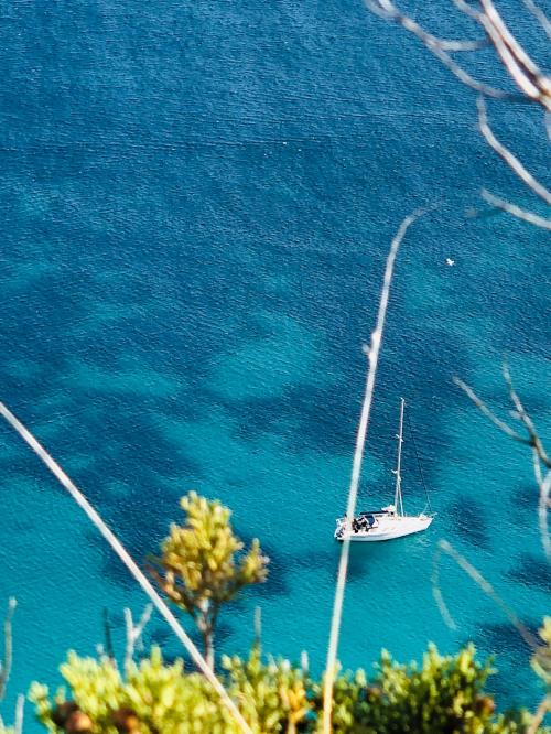 Sailing boat sails in the sea of Cagliari