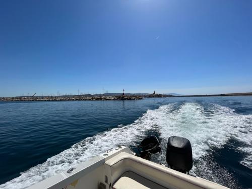 Motor boat during tour in the Gulf of Alghero