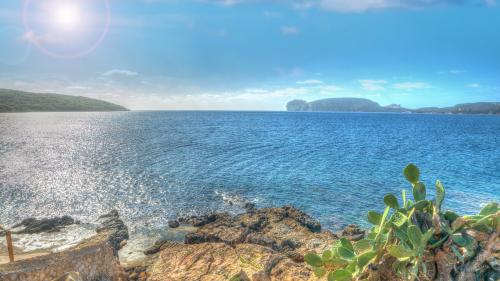 Panoramic sea view Alghero with Capocaccia from afar