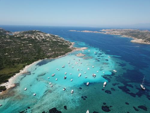 <p>La Maddalena archipelago, boats and crystal clear sea for snorkeling</p>