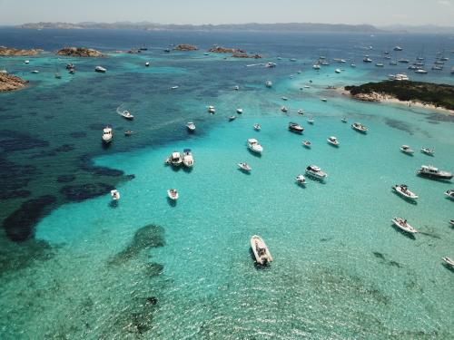 <p>La Maddalena archipelago, boats and crystal clear sea for snorkeling</p>