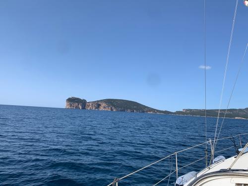 View of Capocaccia from a motor boat during tour