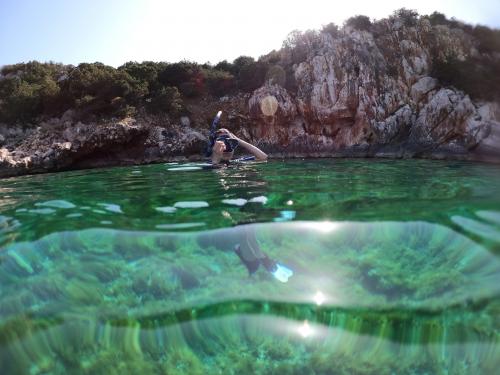 Girl snorkeling in the Gulf of Alghero