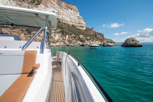 Motorboat in the blue waters of Cagliari