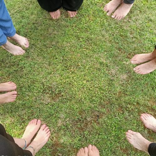 <p>Barefoot on grass in a forest in Cagliari</p>