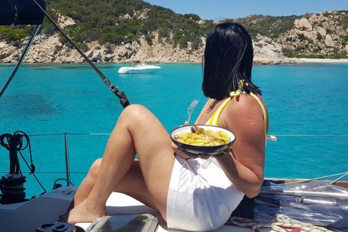 Girl on board the sailing boat during the Tavolara tour