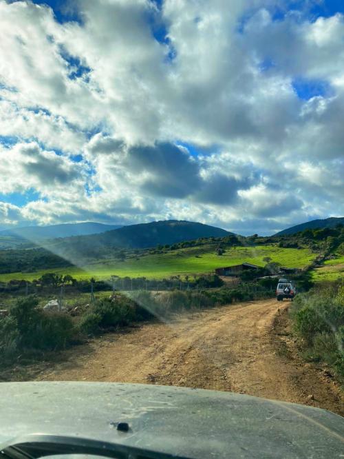 Off-road vehicle and panorama on dirt roads in the territory of Tempio Pausania