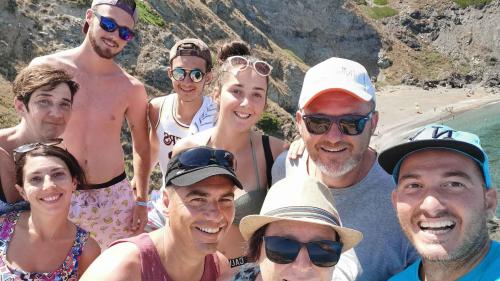 Happy participants during snorkeling tour in the wild beaches of Nurra