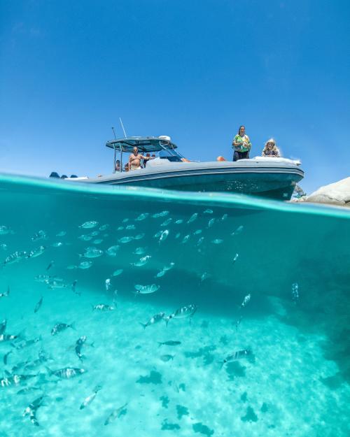 <p>Boat and crystal clear sea of the Archipelago of La Maddalena</p><p><br></p>