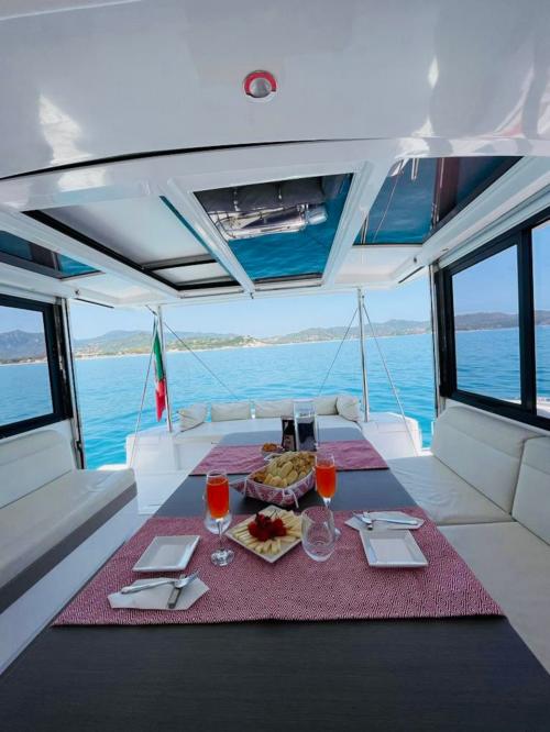 Interior catamaran dining room in Villasimius