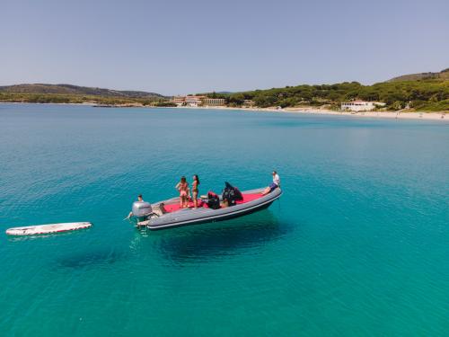 Rubber dinghy during tour in the coves of Alghero