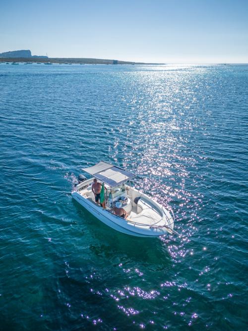 Boat sailing off the coast of Stintino