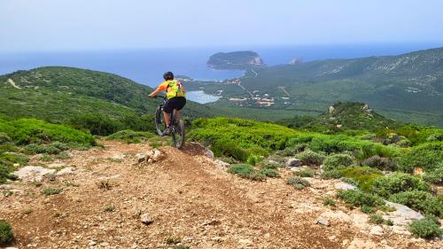 Bikers at the oasis le prigionette arca di noé, Porto Conte Natural Park with panoramic sea views