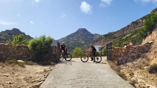 Hiker on electric bicycle in the woods of San Teodoro