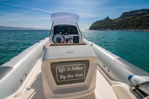 Inflatable boat in the crystal clear waters of Cagliari