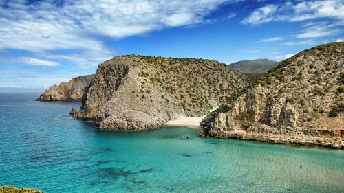 <p>Cala Domestica beach and its turquoise sea</p><p><br></p>