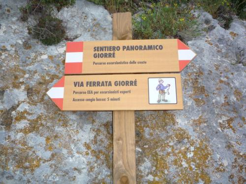 Wooden signs on the via ferrata of Giorrè