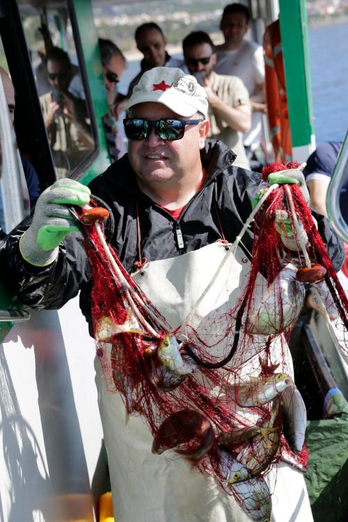 Fisherman with nets caught of the day