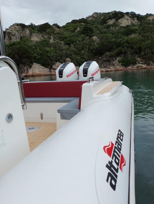 Inflatable boat with awning between the waters of the Archipelago of La Maddalena
