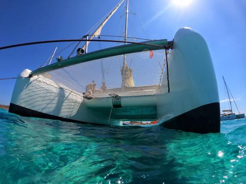 Photo from below of a catamaran in the Archipelago of La Maddalena