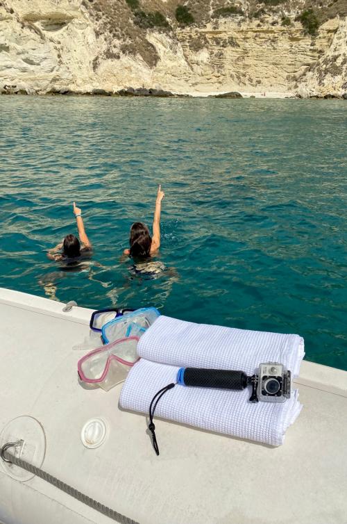 Rubber dinghy with young girls in the Gulf of Cagliari