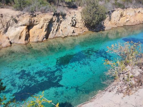 <p>Turquoise water inside the oasis of Biderosa where you can make kayak tours</p><p><br></p>